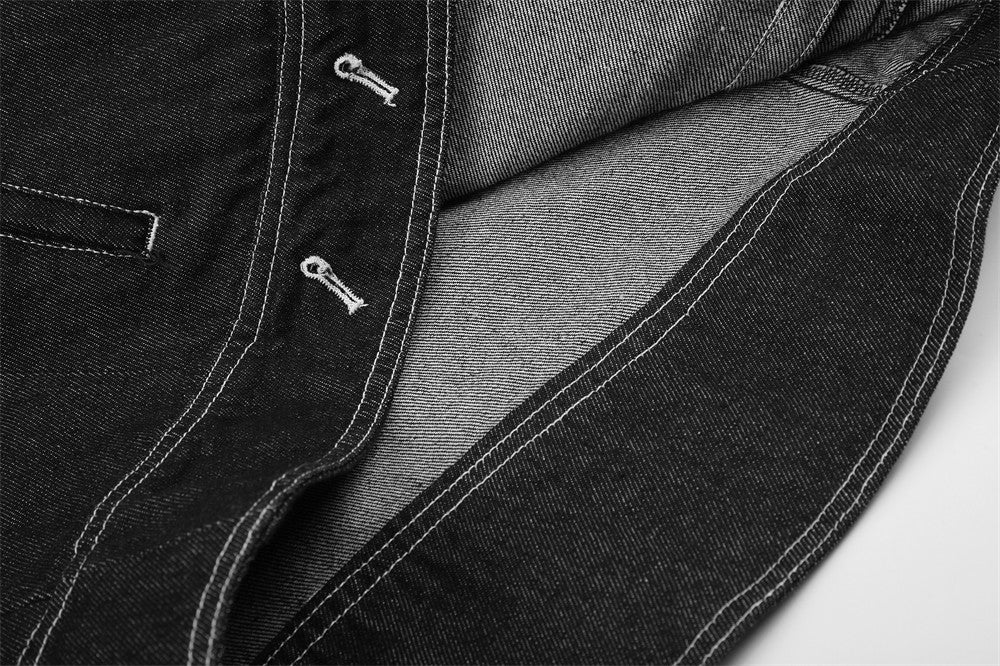 Close-up of black denim jacket interior and lower front opening