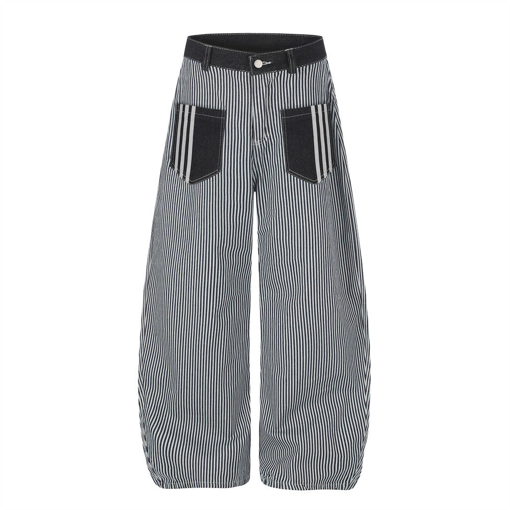 Black and white vertical pinstripe wide-leg barrel jeans with contrast denim waistband and patch pockets, front view