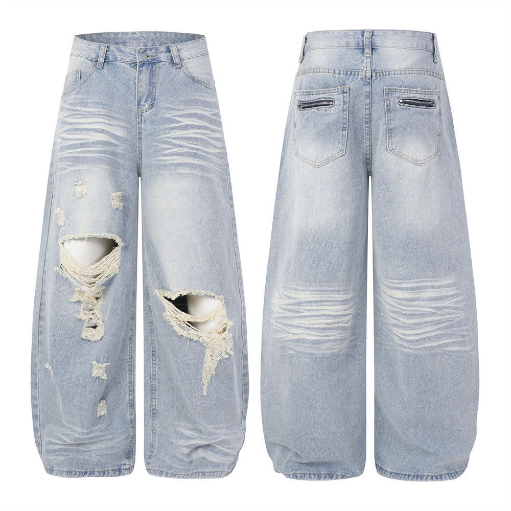 Men's light wash distressed wide-leg baggy jeans with large ripped knee openings and frayed thread detailing, front and back