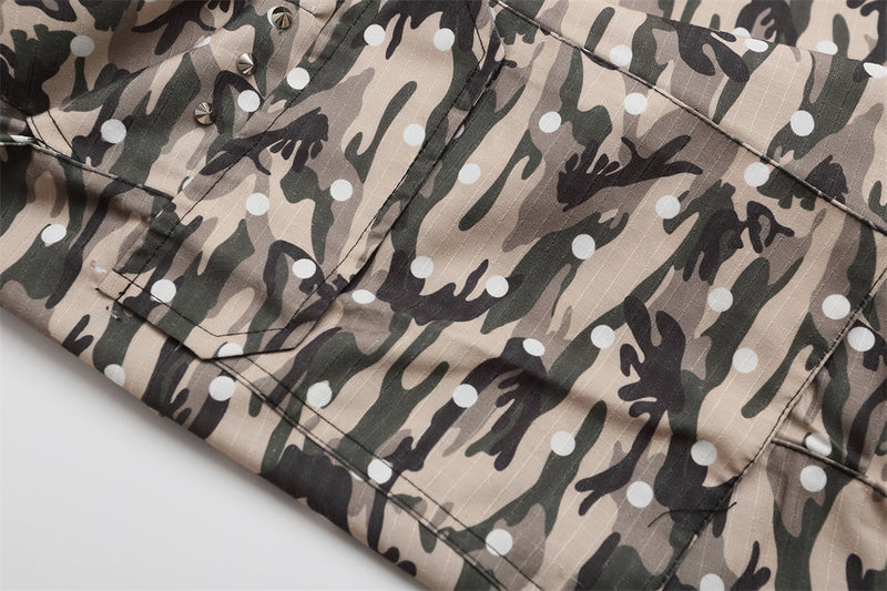 Close-up of camo cargo shorts cargo pocket and lower leg hem
