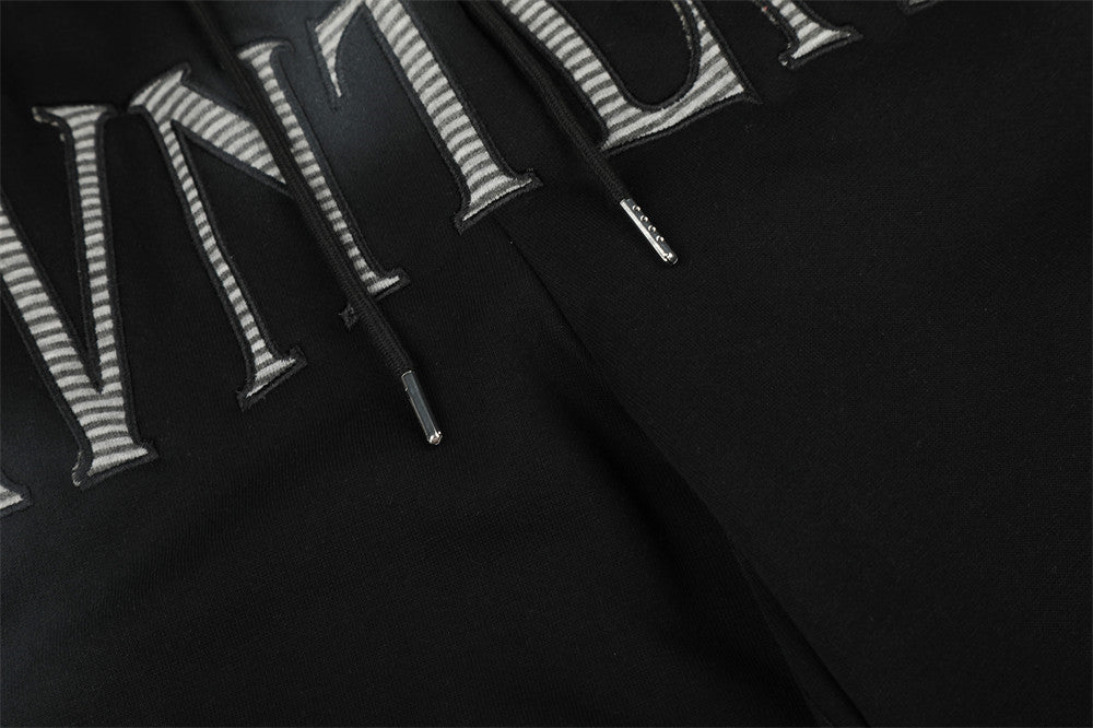 Pantalones de chándal holgados de pernera ancha con lavado efecto spray y gráfico de letras