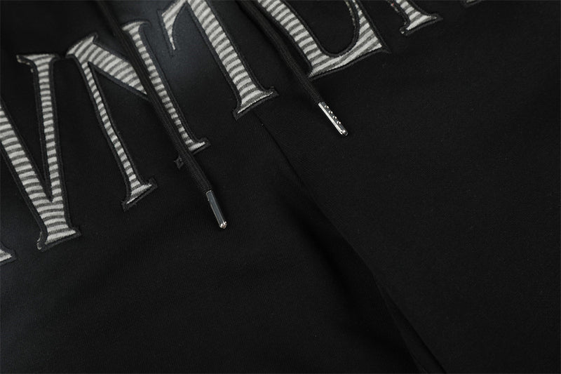 Pantalones de chándal holgados de pernera ancha con lavado efecto spray y gráfico de letras