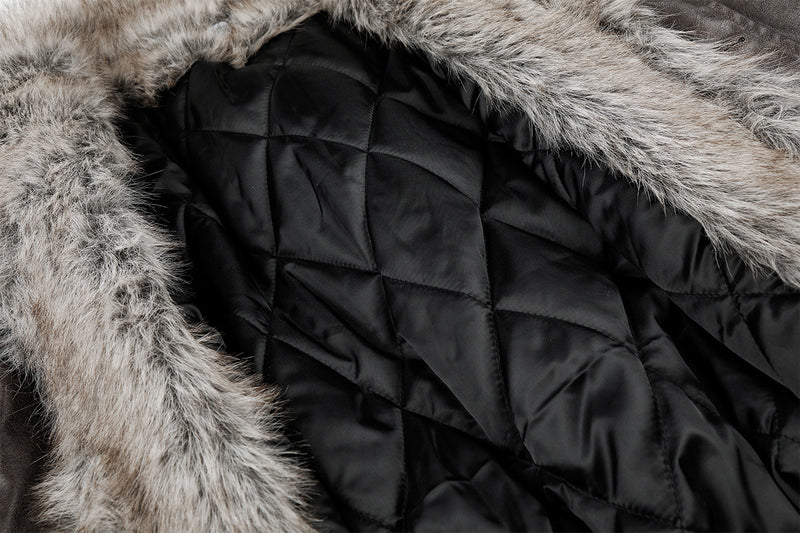 Close-up of black quilted jacket lining bordered by gray fur collar trim