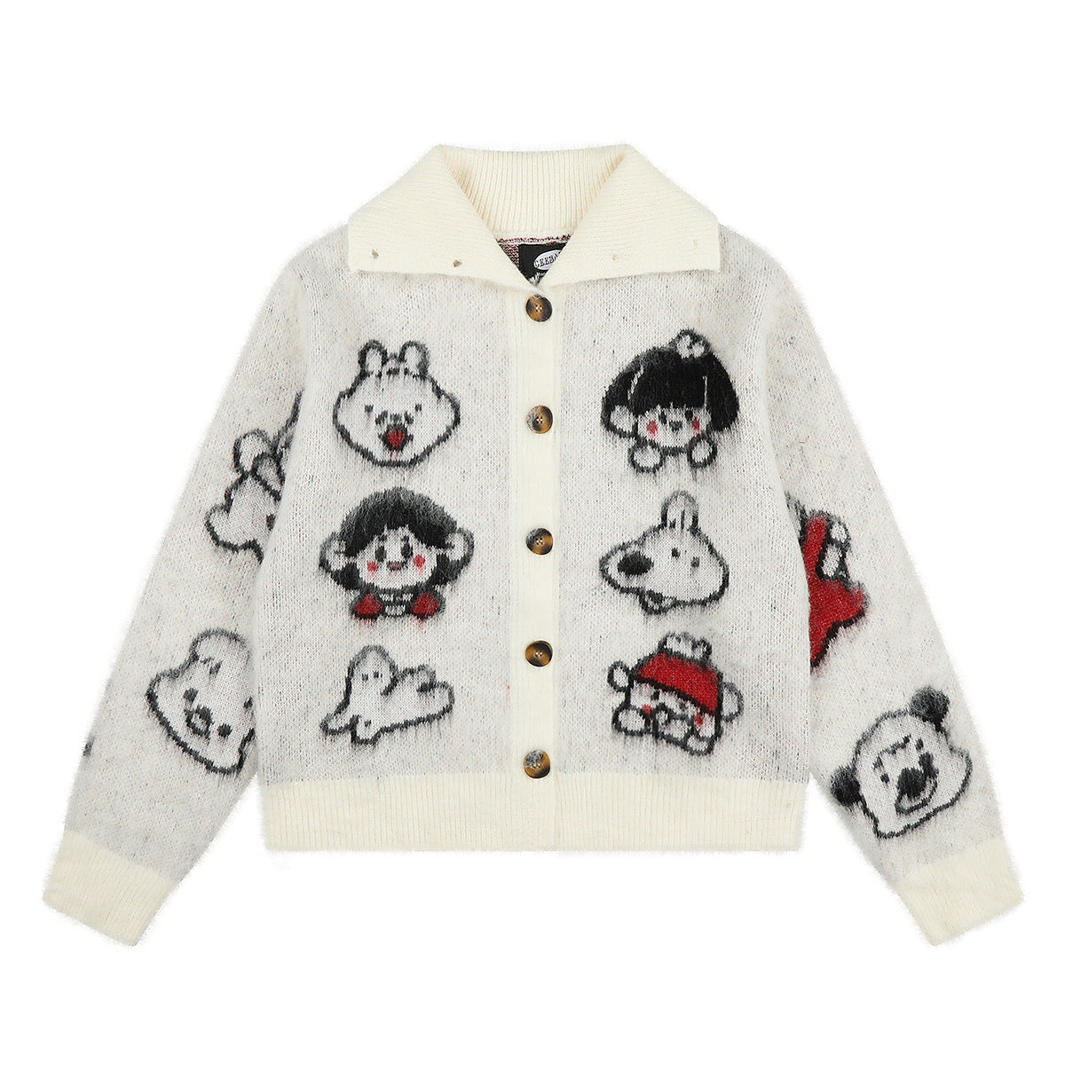 Cream cropped knit cardigan with all-over cartoon character jacquard pattern, spread collar, and tortoiseshell buttons