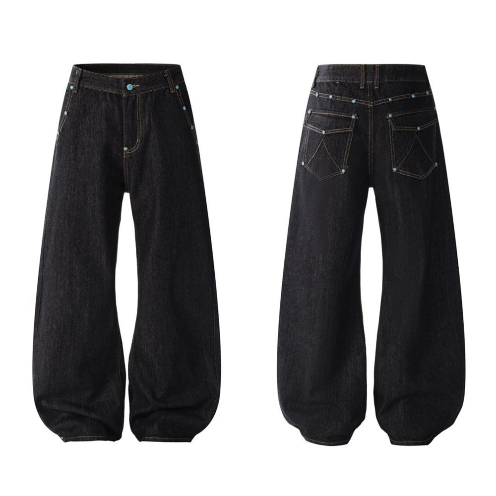 Men's wide-leg barrel jeans with turquoise stud rivets and contrast stitching, shown in raw black, front and back view