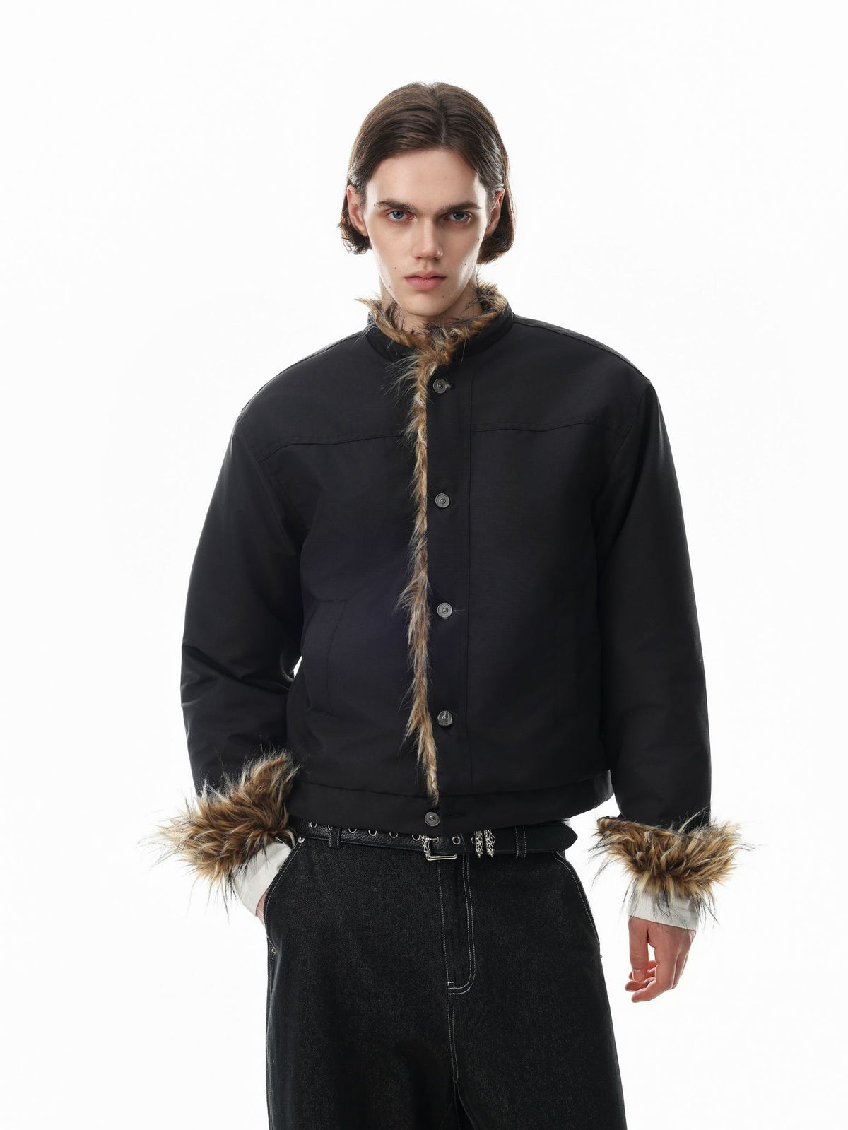 Cropped padded jacket with faux fur trim on collar, button placket, and cuffs in black, worn by male model with wide-leg dark