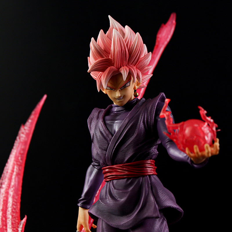 The Seakoff Goku Black Collectible Figure from Dragon Ball Super is a 38cm statue featuring a male anime character with pink spiky hair, wearing a dark purple outfit and red belt. It includes glowing energy effects and an energy sword, making it a standout piece against the black backdrop.