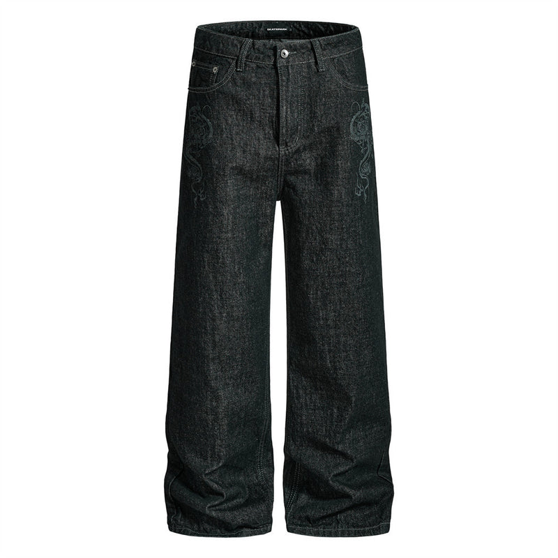 Men's wide-leg black denim jeans with tonal dragon embroidery on front thigh, straight-leg silhouette, front and back view