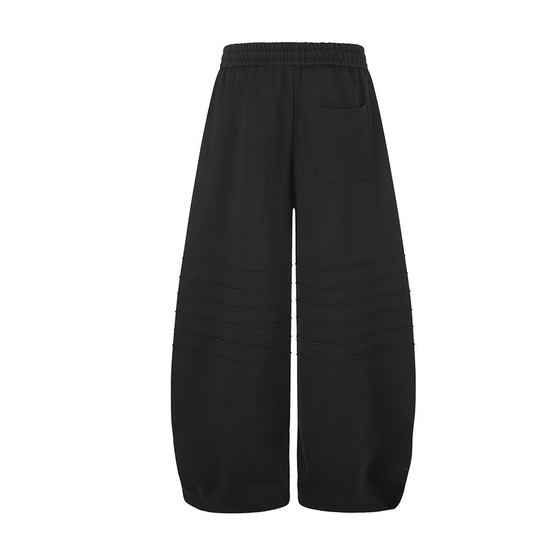 Pantalon de survêtement à jambes larges avec délavage dégradé et plis aux genoux