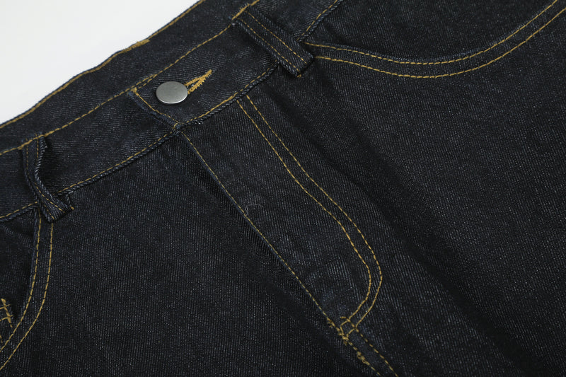 Jean baggy délavé foncé avec bas en fausse fourrure et broderie manuscrite – Coupe ample