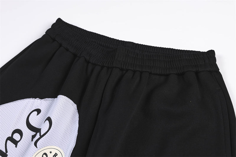 Wide-Leg Sweatpants with Camo & Script Patchwork Appliqués
