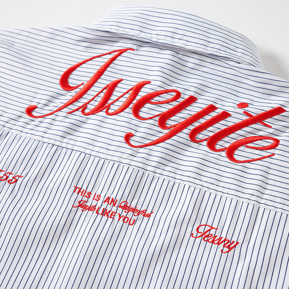Close-up of back yoke with large red embroidered script and small printed details