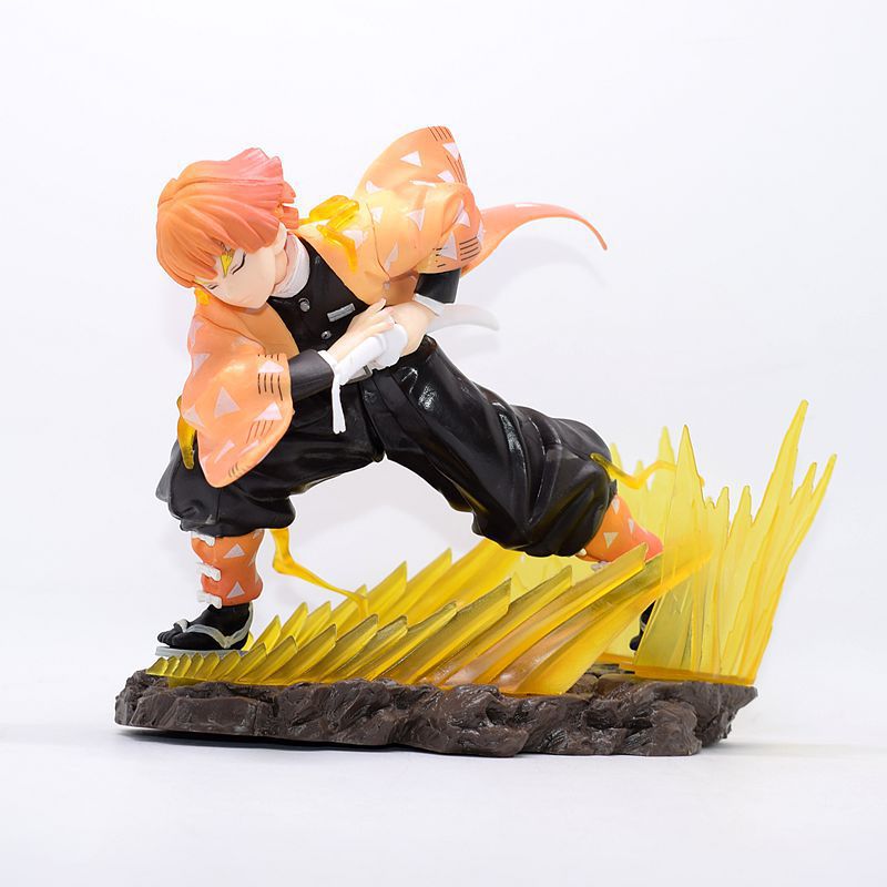 The Demon Slayer Zenitsu Agatsuma Figure is a 14.5cm high-quality PVC collectible featuring Zenitsu in his iconic black outfit with fiery orange hair, draped in a patterned cloak. He stands on a rocky base with stylized yellow waves, embodying Thunder Breathing grace. Weight: 300g.