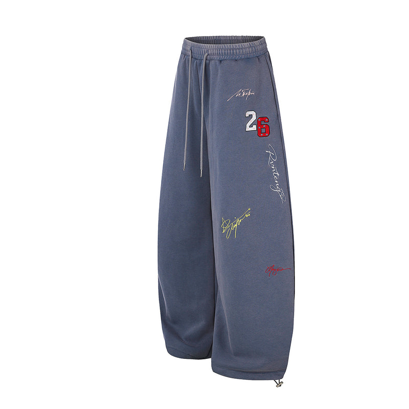 Pantalon de survêtement à jambes larges avec broderies graffiti signature et numéro 26
