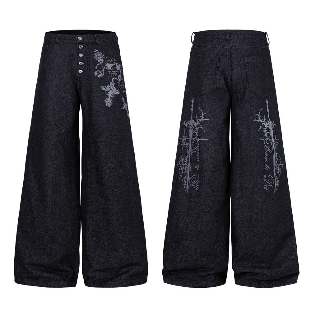 Black wide-leg denim jeans with gothic cross and sword graphic print, button-fly closure, front and back view