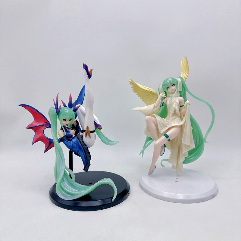 The Hatsune Miku Light &amp; Dark 17cm PVC figures feature a demon with green hair, red wings, and a black outfit, while the angel has yellow wings and a flowing white dress. Both are elegantly designed under the Hatsune Miku brand.