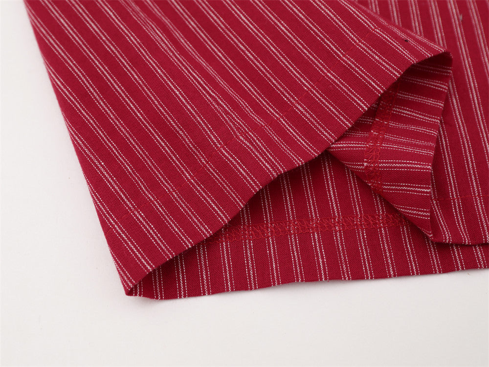 Close-up of red striped shirt hem and side seam stitching