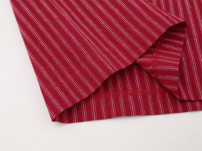 Close-up of red striped shirt hem and side seam stitching