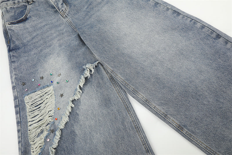 Jean large déchiré pour homme avec ornements en strass et étoiles
