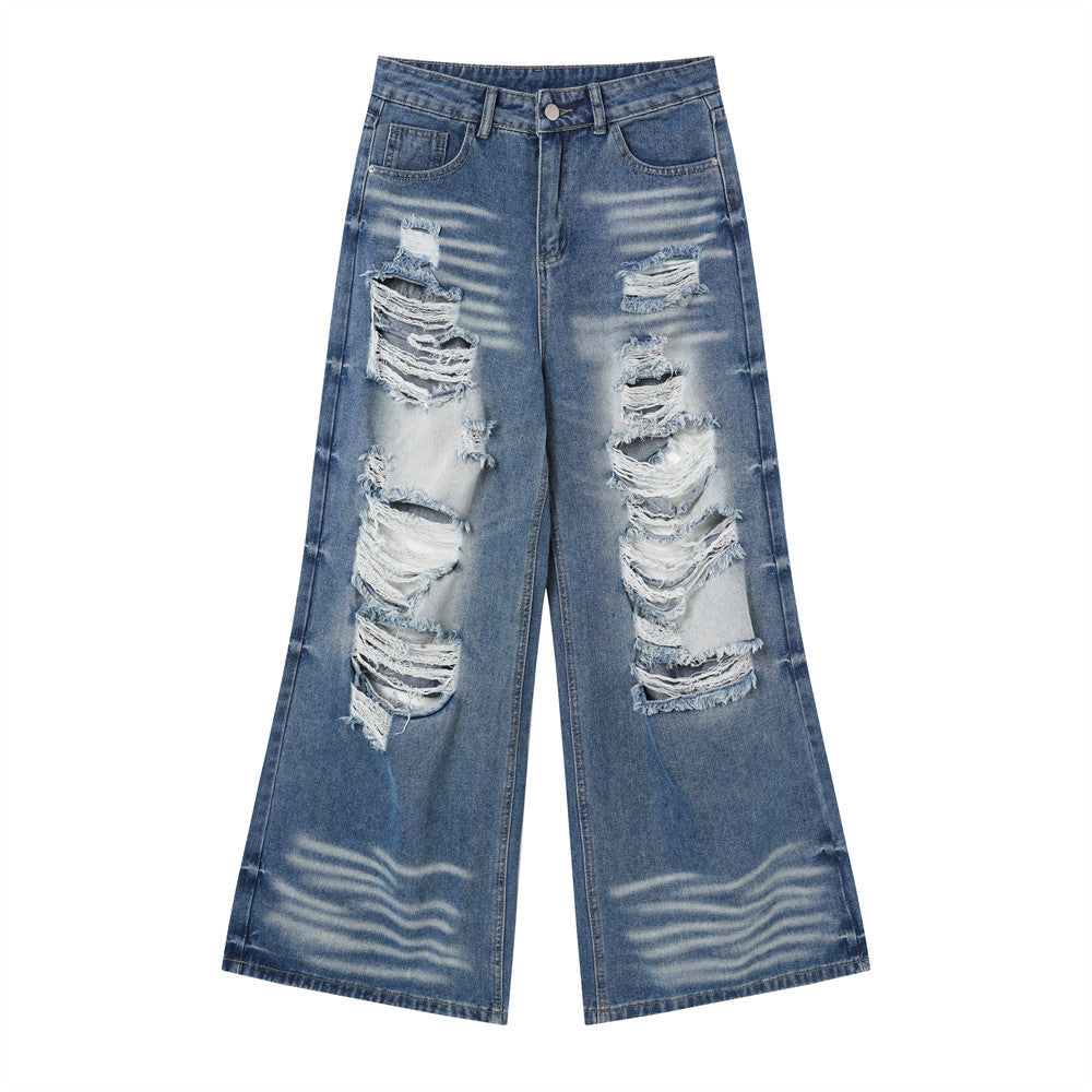 Front view of wide-leg blue jeans with torn knees and faded whiskering