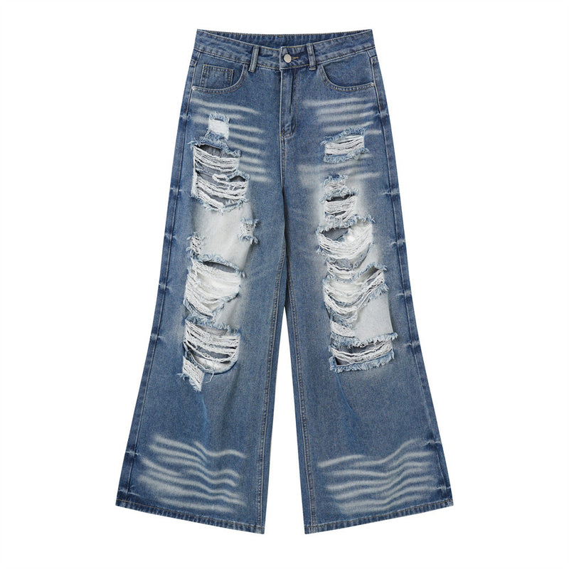 Front view of wide-leg blue jeans with torn knees and faded whiskering