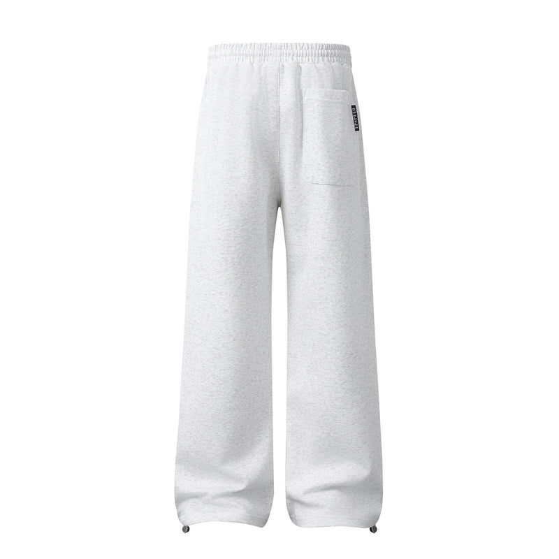 Pantalon de survêtement à jambes larges avec graphisme héraldique et détails latéraux multibandes