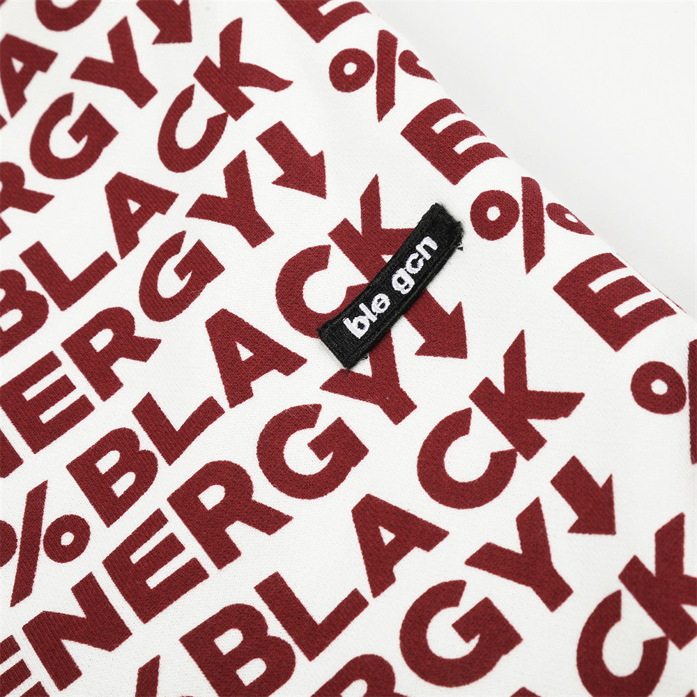 Close-up of red BLACK ENERGY lettering and small black woven brand label
