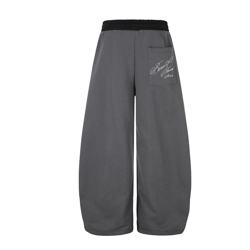 Pantalon de survêtement large à inscription et ceinture contrastante