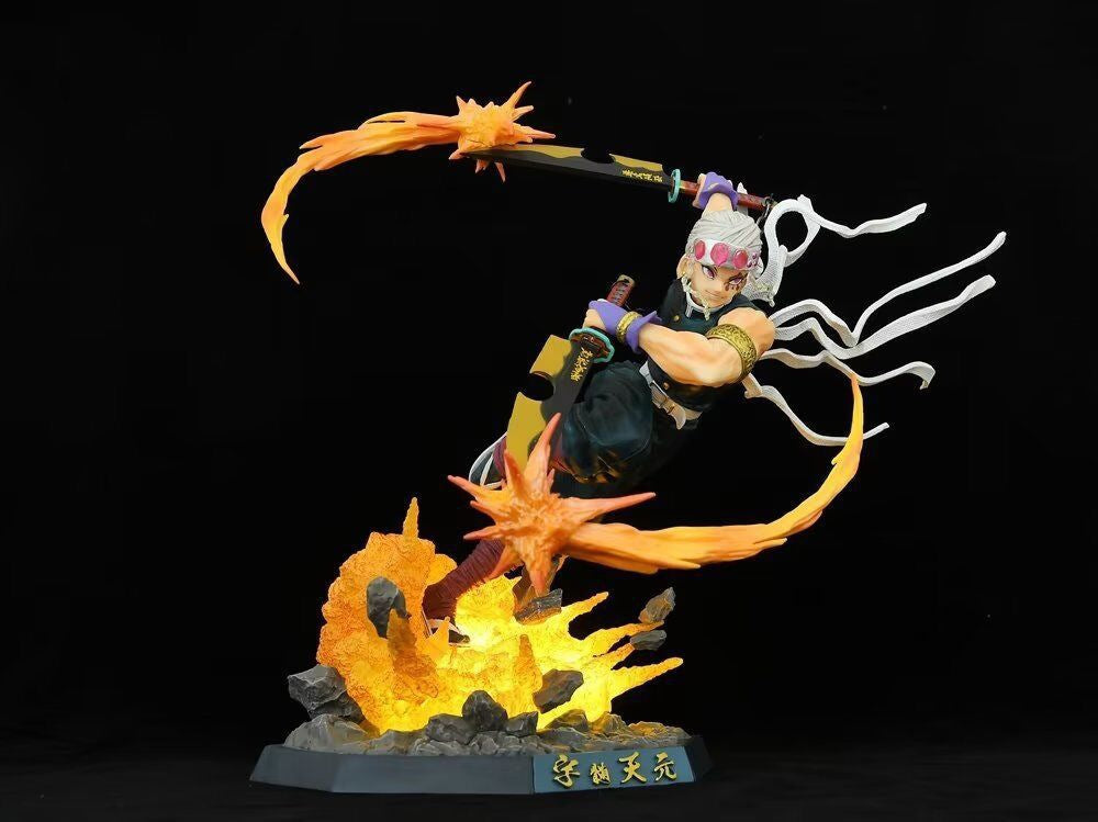 The Premium Demon Slayer Urogi Figure by Demon Slayer captures the character mid-leap with a sword and daggers among flame effects. Set on a rocky base with Chinese characters, it features white hair, a pink-jewel headband, and sleeveless outfit. USB light-up effects enhance its allure.