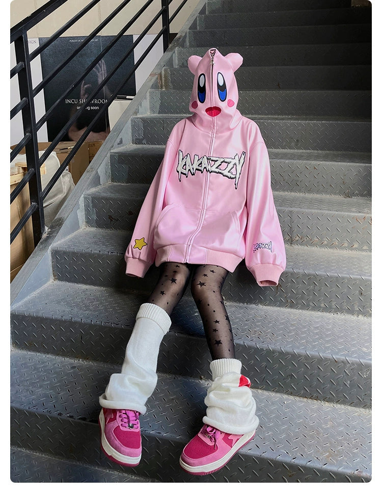 A person sitting on metal stairs showcases streetwear style wearing Seakoff&