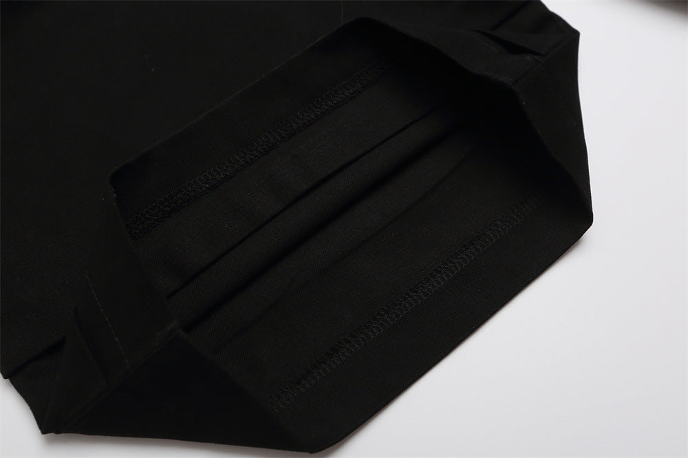 Close-up of black shorts back hem with stitched cuff detail