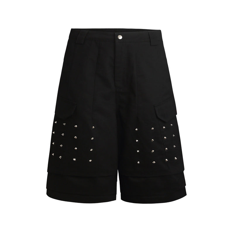 Black cargo shorts front view with studded panel details and layered hem