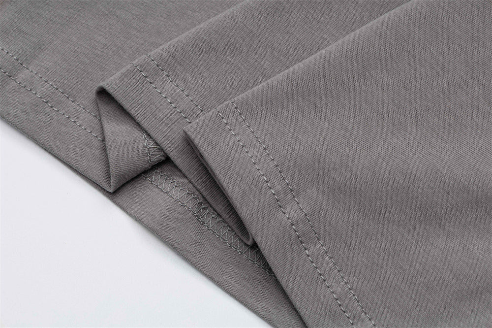 Close-up of gray T-shirt sleeve cuffs with stitched hems