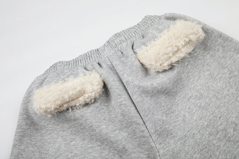 Pantalon de survêtement à jambes larges avec ceinture en sherpa et étoiles brodées