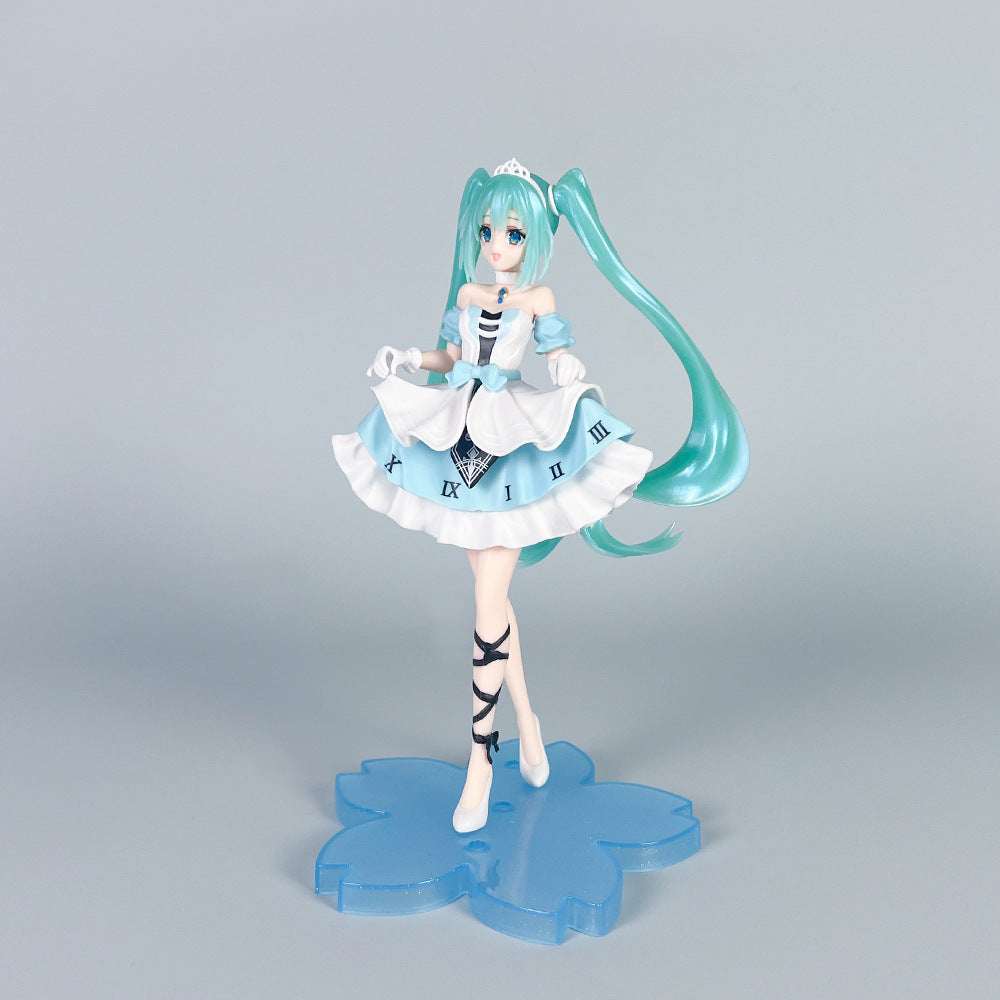 The &quot;Hatsune Miku Cinderella Fairy Tale 20cm PVC Figure&quot; features an anime-style character with turquoise pigtails, a blue and white frilled dress adorned with Roman numerals, and stands on a blue flower-shaped base, exuding a fairy tale aura against a plain gray backdrop. Perfect for collectors!.