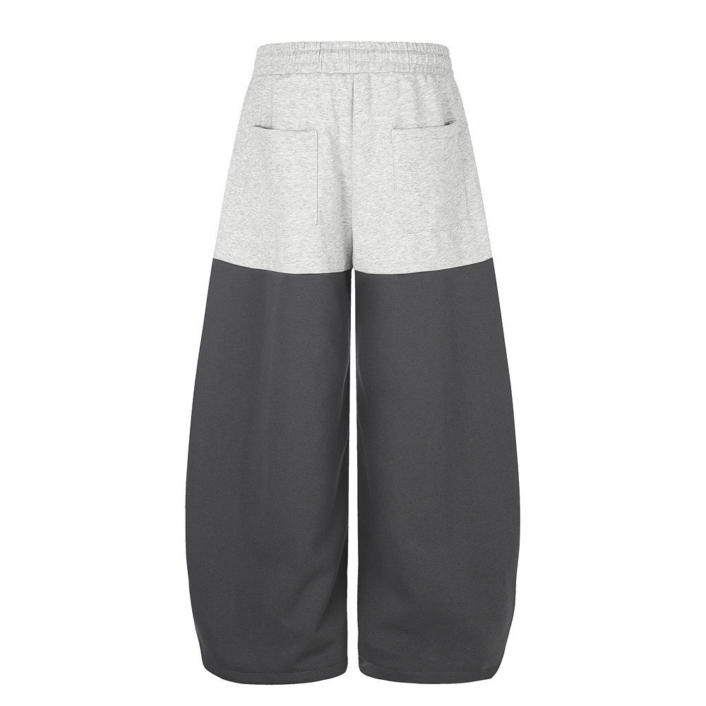 Pantalones de Chándal de Pierna Ancha con Bloques de Color y Detalles Gráficos de Tachuelas Plateadas