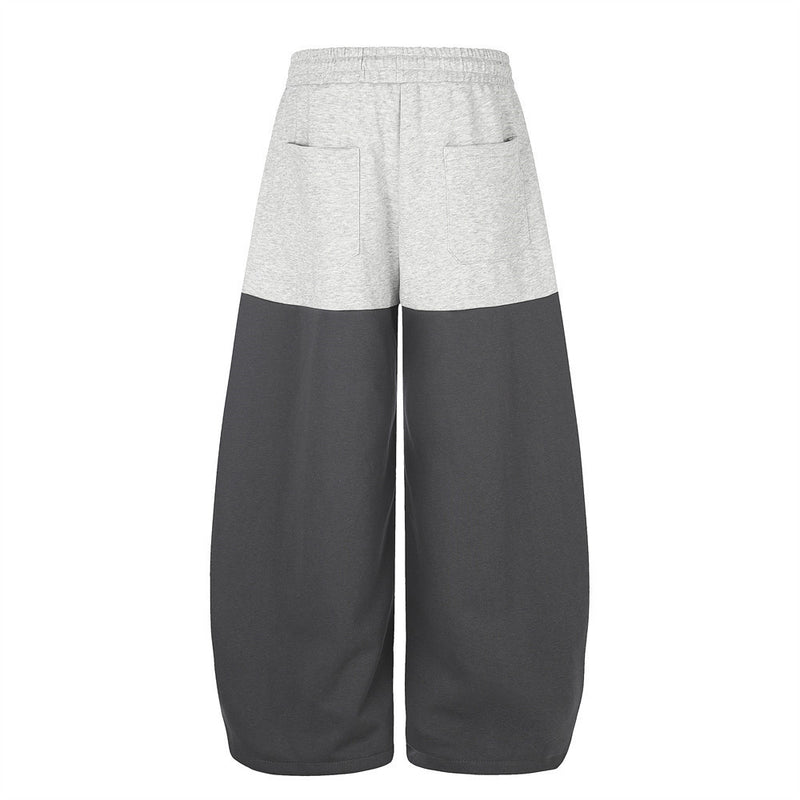 Pantalones de Chándal de Pierna Ancha con Bloques de Color y Detalles Gráficos de Tachuelas Plateadas