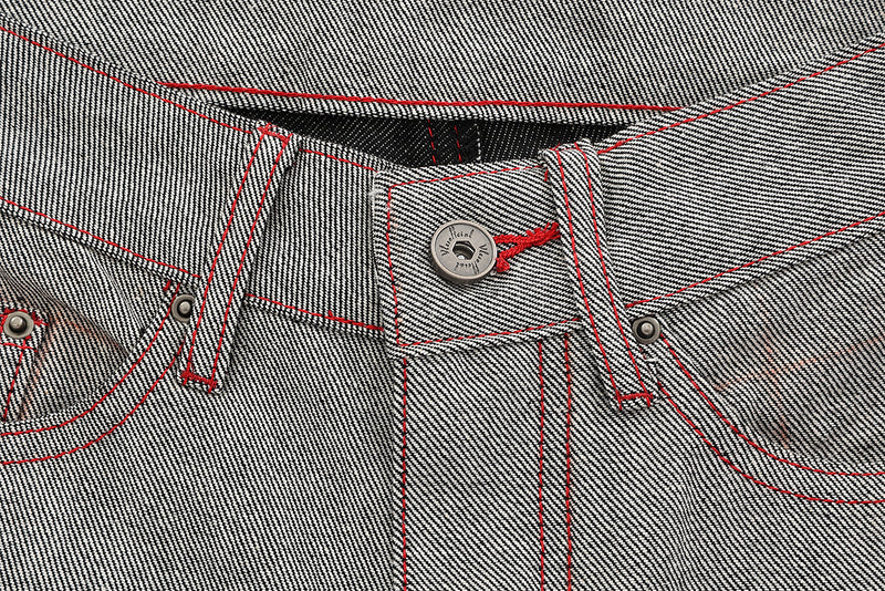 Jean wide leg bicolore à empiècements contrastants et broderie manuscrite – Coupe droite en denim brut