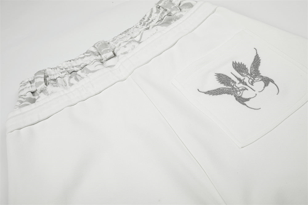 Pantalon de survêtement large avec motif « YOU » en strass et double ceinture – Blanc