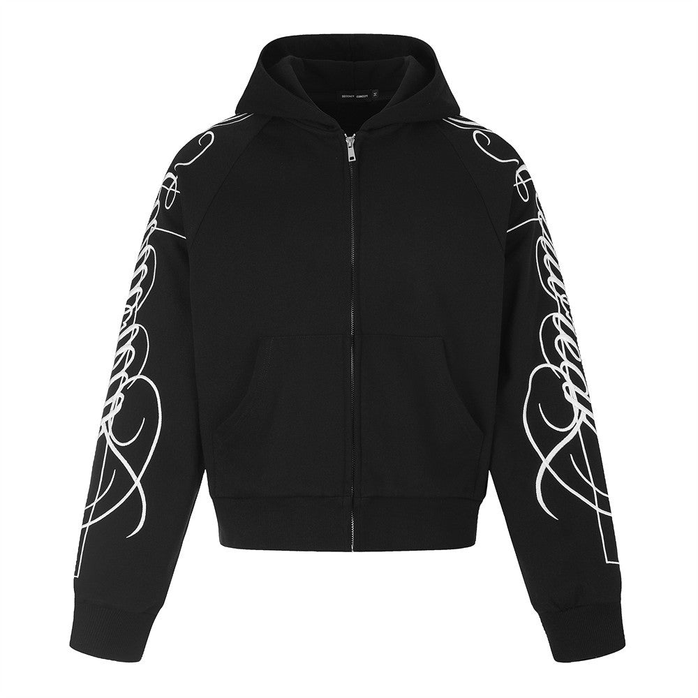 Sweat à capuche zippé noir, avec inscription cursive blanche et motifs en spirale imprimés sur les deux manches, vue de face