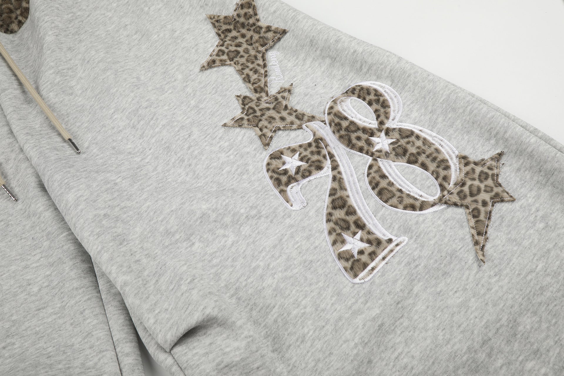 Baggy-Sweatpants mit Leopardenbund und Stern-Applikation
