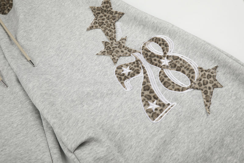 Baggy-Sweatpants mit Leopardenbund und Stern-Applikation