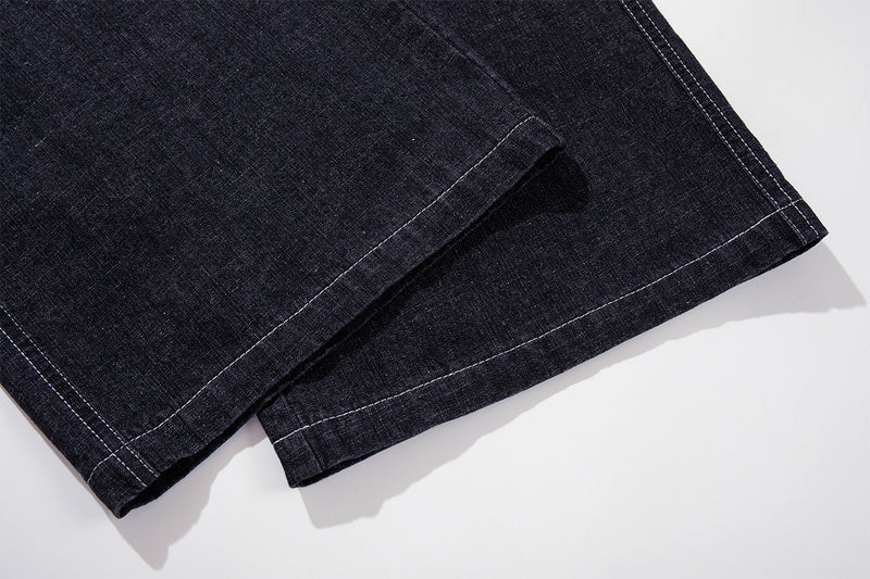 Vaqueros baggy de pierna ancha, lavado oscuro, bragueta diagonal de botones y denim crudo