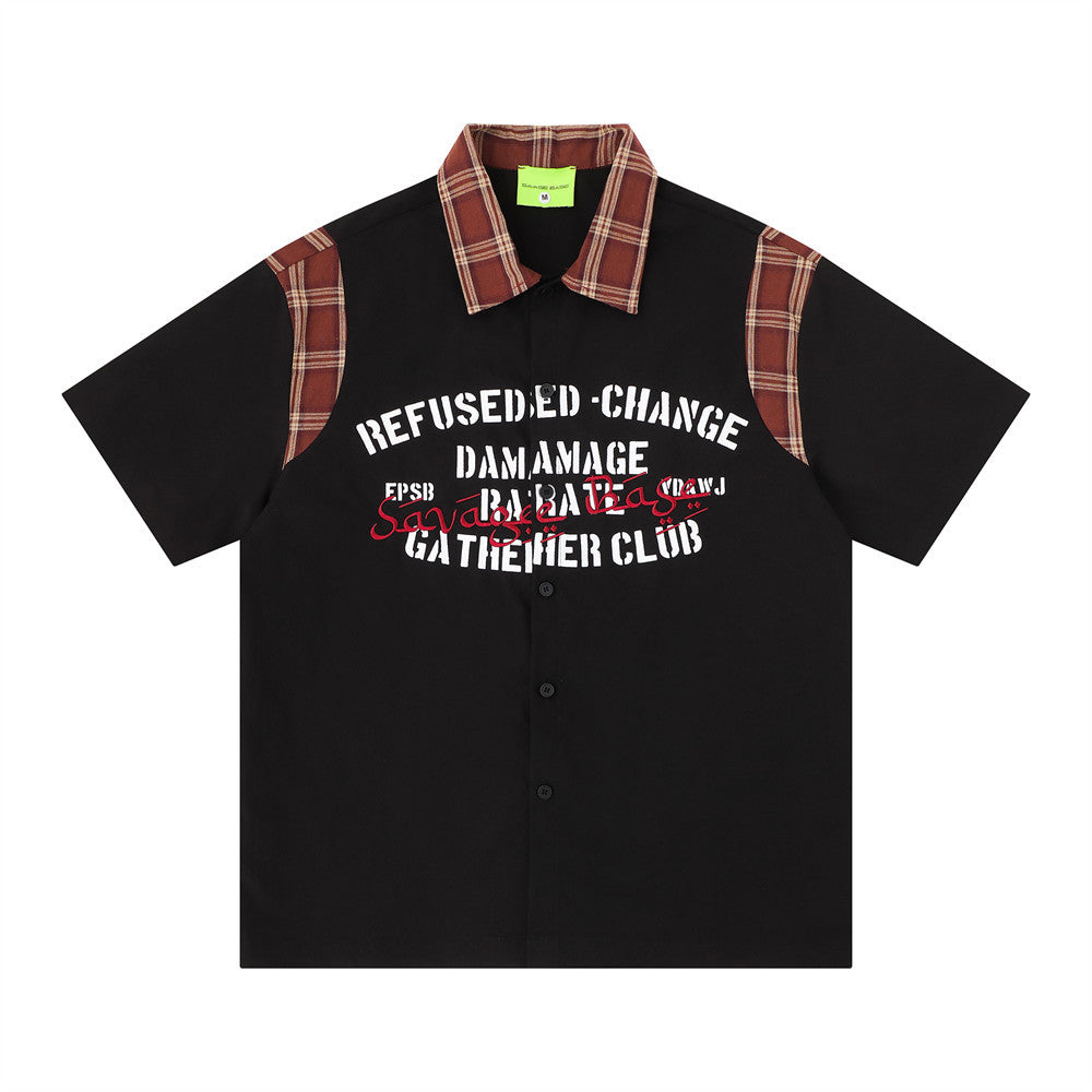 American streetwear plaid patchwork short sleeve shirt in black with rust-red tartan collar and shoulder panels and bold grap