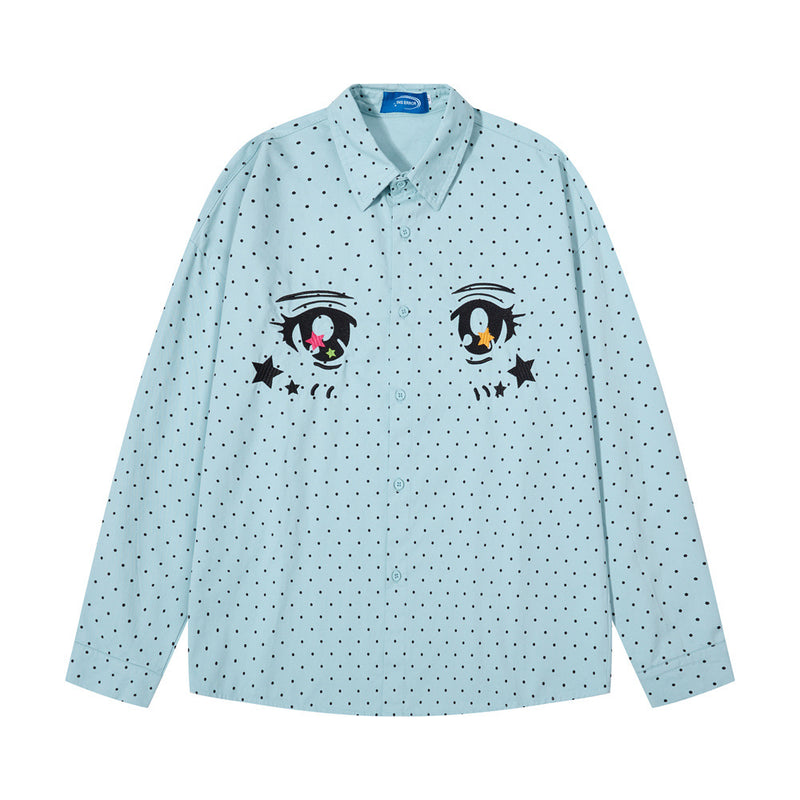 Front view of a light blue long sleeve button-down shirt with anime eyes and black polka dots