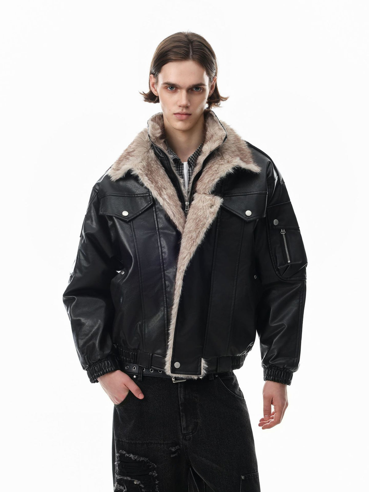 Oversized faux leather fur-lined bomber jacket with shearling collar in black, worn open to show cream fur interior lining