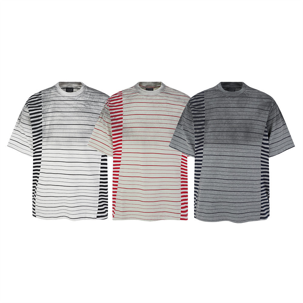 Distressed stripe patchwork oversized t-shirt in white black, cream red, and grey navy colorways, flat lay product shot