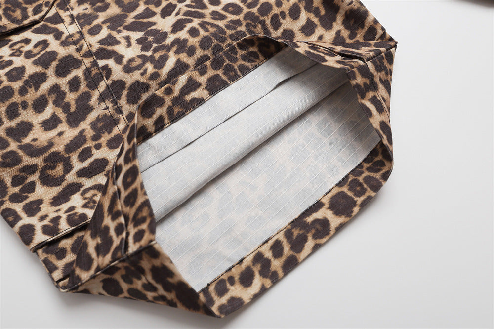 Close-up of leopard print cargo shorts hem showing white striped lining inside the cuff
