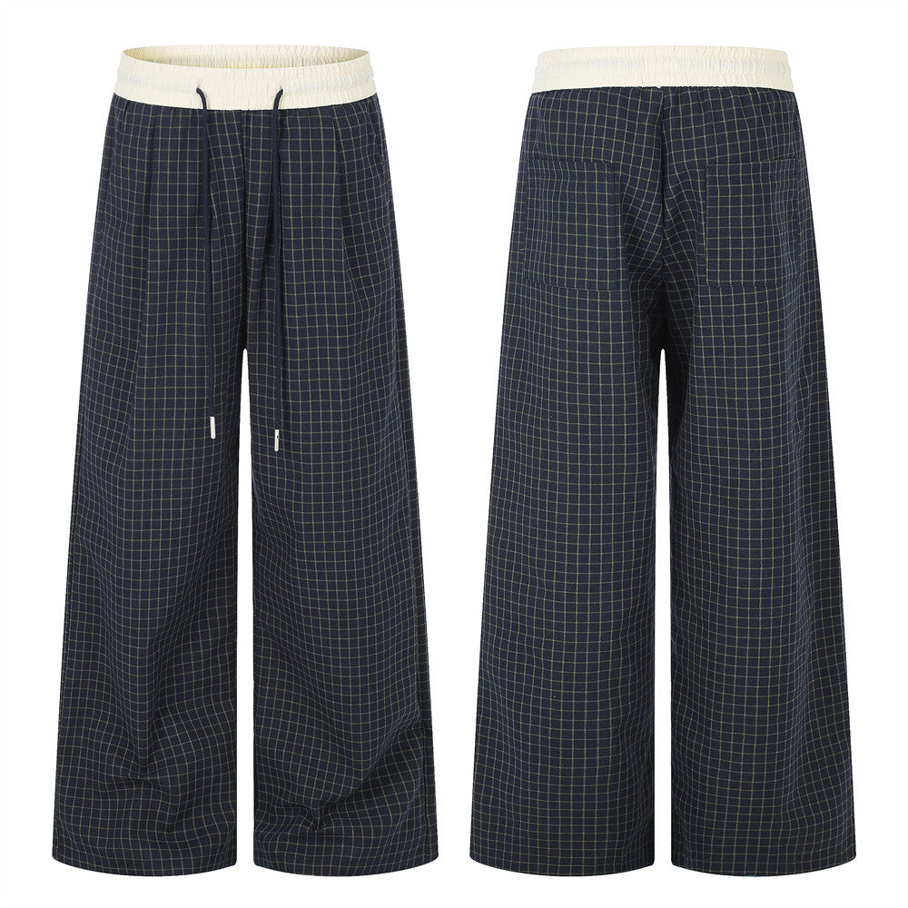 Men's wide-leg navy plaid trousers with cream contrast elastic waistband and drawstring, front and back view