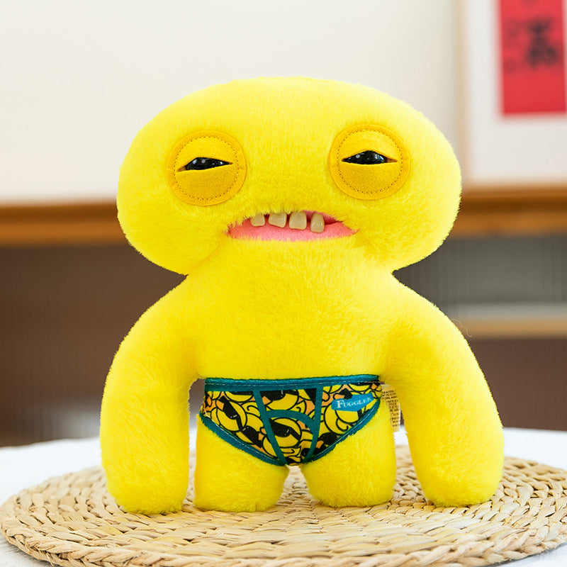 22 cm gelbes Monster-Plüschtier – Pelzige Kreatur, weiches Spielzeug mit Bananenmuster-Shorts